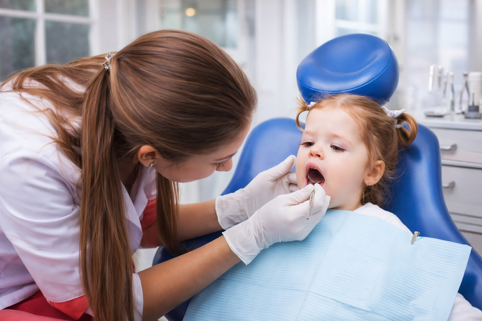 Child happily receiving dental check-up at childcare centre